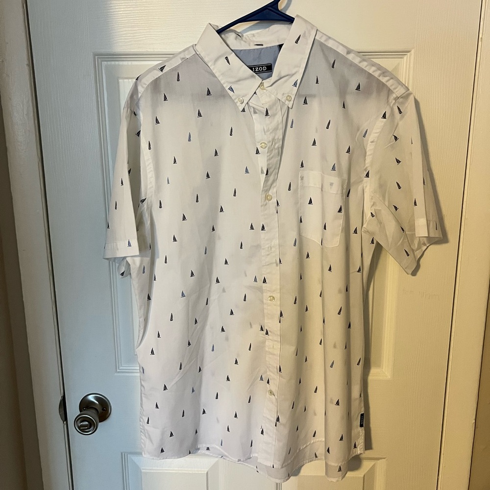 IZOD white shirt sleeved button down with light and dark blue ships. XL.